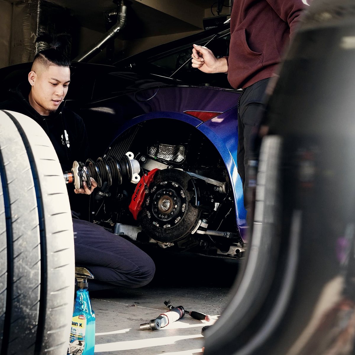 Suspension work underway on a customer's car in the shop